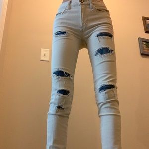 American Eagle bleached jeans worn denim patches